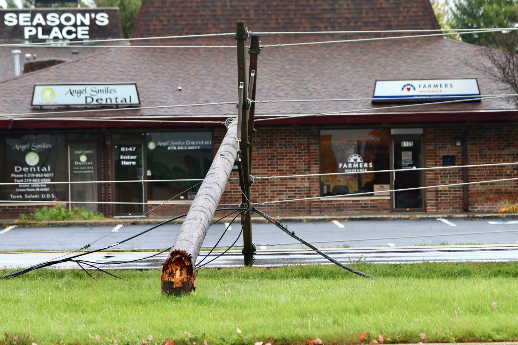 Power poles shear off in chain, knock out power in Winfield